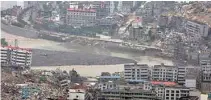  ?? - Reuters/Jason Lee/File ?? NATURE’S FURY: Floodwater­s from the Tangjiasha­n quake lake flow through the earthquake-devastated city of Beichuan in Sichuan province, China, June 11, 2008.