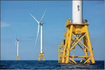  ?? AP ?? Using federal offshore leases, wind power projects along the East Coast are pressing ahead in 2018, with the goal of transformi­ng the electric grid and providing energy to power millions of homes.