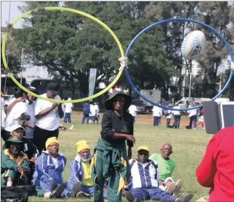  ?? PICTURE: MARILYN BERNARD ?? Sibongile Ngubane excels in throwing a rugby ball through a moving hoop during the provincial Golden Games at the KIngs Park athletics stadium in Durban yesterday. (grandmothe­rs) and (grandfathe­rs) came from all over the province to take part in the...