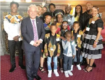  ??  ?? MAKING A DIFFERENCE: British House of Commons Speaker John Bercow with Business Report journalist Wiseman Khuzwayo’s widow, Anna, wearing headgear, and their children at the launch of the Wiseman Khuzwayo PhD Scholarshi­p in Refugees and Human...