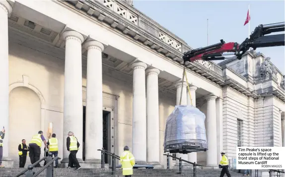  ?? ROBIN MAGGS ?? Tim Peake’s space capsule is lifted up the front steps of National Museum Cardiff