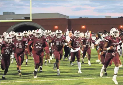  ?? BRAD VEST/THE COMMERCIAL APPEAL, ?? The Horn Lake football team runs onto the field before the start of the game versus Desoto Central on Sept. 28, 2018.