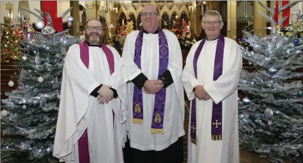  ??  ?? Rev Martin O’Kelly, Rev Baden Stanley and Arch Deacon Gordon Linney at the ‘Walking in a Winter Wonderland’ Christmas tree festival in Christ Church Bray.