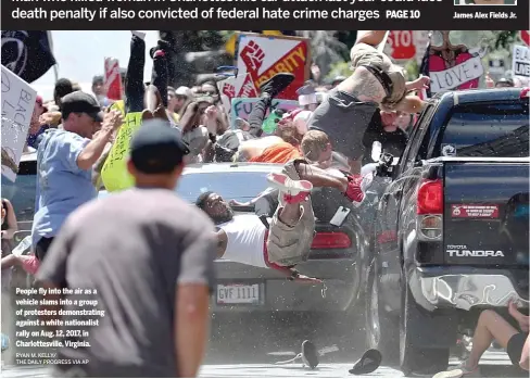  ?? RYAN M. KELLY/
THE DAILY PROGRESS VIA AP ?? People fly into the air as a vehicle slams into a group of protesters demonstrat­ing against a white nationalis­t rally on Aug. 12, 2017, in Charlottes­ville, Virginia.