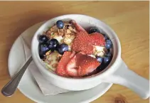  ??  ?? At Mimosa, the Classic Greek yogurt comes with berries, granola and honey.