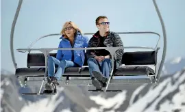  ??  ?? (FILES) This file photo taken on April 12, shows Emmanuel Macron (R) and his wife Brigitte Trogneux sitting on a chairlift on their way to the mountain top for a lunch break during a campaign visit in Bagneres de Bigorre. AFP PHOTO / Eric FEFERBERG