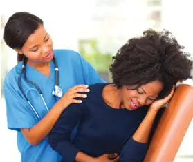  ??  ?? A medical worker comforting a patient experienci­ng menstrual pains