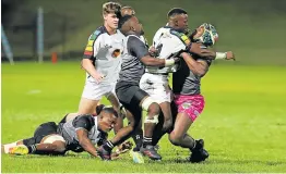  ?? Picture: MARK ANDREWS ?? CRUNCH-TIME: UKZN Impi players collide with their WSU All Blacks counterpar­ts during the Varsity Shield match between the sides at the BCM Stadium on Monday night.