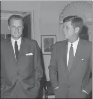  ?? THE ASSOCIATED PRESS ?? Evangelist Billy Graham, left, talks with President John F. Kennedy during a call at the White House in 1961. Graham, who transforme­d American religious life through his preaching and activism, becoming a counselor to presidents and the most widely...