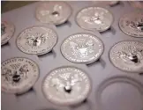  ?? SCOTT EELLS/BLOOMBERG ?? One-ounce silver Liberty coins in a tray at the United States Mint at West Point in New York in 2013.