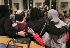  ?? JULIE JACOBSON — THE ASSOCIATED PRESS ?? On Feb. 16, members of the Sisterhood Salaam Shalom, gather for a group photo after a unity vigil held at the Jewish Theologica­l Seminary in New York. The Sisterhood of Salaam Shalom, a national organizati­on that brings together Muslim and Jewish...