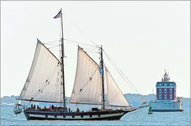  ?? SEAN D. ELLIOT/THE DAY ?? The schooner Mystic Whaler sails past Ledge Light on Friday.