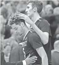  ?? ASSOCIATED PRESS ?? Vanderbilt's Luke Kornet (right) consoles guard Matthew Fisher-Davis following the team's 68-66 loss.