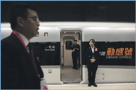  ??  ?? A Vibrant Express train bound for Guangzhou at West Kowloon Station in Hong Kong yesterday, where there will be immigratio­n checks. The new rail link between Hong Kong and southern China will also be patrolled by mainland security AFP