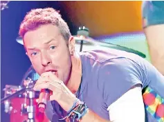  ??  ?? Martin of Coldplay performs onstage during the 2015 American Music Awards. — AFP file photo