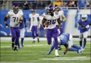  ?? RICK OSENTOSKI — THE ASSOCIATED PRESS ?? Minnesota Vikings running back Latavius Murray (25) breaks downfield during the second half of an NFL football game against the Detroit Lions, Thursday in Detroit.