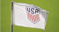  ?? PHELAN M. EBENHACK/ASSOCIATED PRESS FILE PHOTO ?? The U.S. Soccer Federation logo is viewed in January on a corner flag on the pitch in Orlando, Fla. The federation and the union for its women’s national team agreed to a three-month extension of their labor contract through March, a move announced on the same day players filed a brief asking a federal appeals court to reinstate their equal pay claim.
