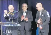  ?? Luis Sinco Los Angeles Times ?? OLAF VUGTS, left, and Coen Bertens, right, accept Thea Award at Disneyland Hotel on Saturday night.