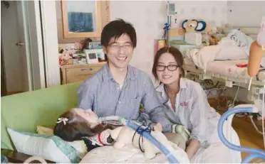  ?? Photo courtesy of Jyajya Films+roa film ?? PARENTAL CARE: Risa (right), Hidekatsu Nishimura
(left) and their daughter Honoka.