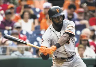  ?? Scott Taetsch / Getty Images ?? The Giants traded outfielder Austin Jackson (pictured above), with reliever Cory Gearrin and pitching prospect Jason Bahr, to the Rangers for a player to be named or cash considerat­ions.