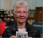  ??  ?? Jan Miller with a photograph of herself as a young child with her family