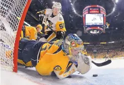  ?? BRUCE BENNETT/POOL PHOTO VIA AP ?? Nashville goalie Pekka Rinne stops a shot by Pittsburgh’s Jake Guentzel (59) in the Predators’ win over the Penguins in Game 4 Monday.