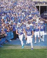  ?? George Frey / Associated Press ?? A deal BYU has made available to its football players could test how much allowing athletes to be compensate­d by outside companies for name, image and likeness can be used as a competitiv­e advantage.