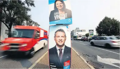  ?? JOHN MAHONEY / POSTMEDIA NEWS FILES ?? Election posters for Parti Québécois candidate Carole Vincent and Liberal Enrico Ciccone in the Marquette riding covering Lachine and Dorval, west of Montreal. Voters go to the polls Monday in the provincial election.