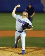  ?? BUTCH DILL — THE ASSOCIATED PRESS ?? Florida pitcher Jack Leftwich throws during the first inning of a Southeaste­rn Conference tournament NCAA college baseball game against LSU, Friday in Hoover, Ala.