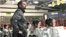  ?? ?? New Prairie Hockey Academy U16 Prep coach Rob Holoien behind the bench with the Battleford­s North Stars.