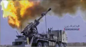  ?? SYRIAN CENTRAL MILITARY MEDIA ?? A still from video provided Wednesday by the government-controlled Syrian Central Military Media shows firing on militant positions on the Iraq-Syria border. Officials said Islamic State militants left their last stronghold after a government offensive.