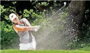  ?? [PHOTO BY STEVE SISNEY, THE OKLAHOMAN] ?? Oklahoma State golfer Emma Broze hits from a bunker during her round on Friday in the NCAA Women’s Golf Championsh­ips at Karsten Creek Golf Club in Stilwater.