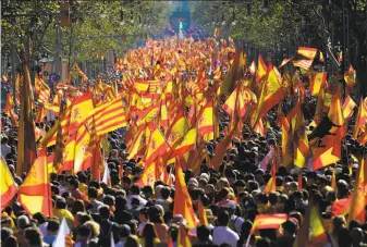  ?? Pierre-Philippe Marcou / AFP / Getty Images ?? Demonstrat­ors gather in Barcelona for a unity rally. The marchers describe themselves as the silent majority who have been ignored during the wealthy region’s bid for independen­ce.