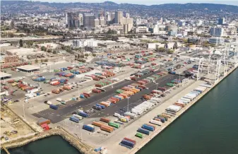  ?? Noah Berger / Special to The Chronicle 2018 ?? A colorful array of shipping containers rests at Howard Terminal, which covers layers of earlier industrial uses, next to the bay in Oakland where the A’s want to build their new ballpark.