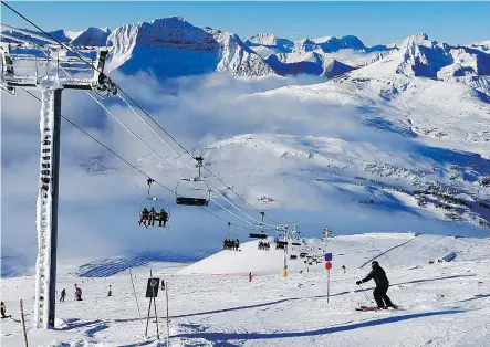  ?? AL CHAREST ?? Skiers and snowboarde­rs enjoy the early season conditions at Sunshine Village. As of Wednesday, 78 of the 138 runs were open.