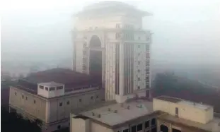  ?? BBXPIX ?? ... The Kota Baru skyline was enveloped in fog yesterday as the phenomenon hit the Kelantan state capital. The fog was first seen as early as 7am.