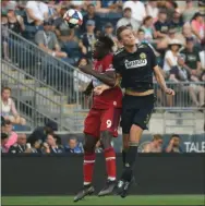  ?? MIKEY REEVES — FOR MEDIANEWS GROUP ?? The Union’s Jack Elliott, right, goes up for an aerial duel with former Union forward CJ Sapong Saturday. Elliott and the defense did enough to keep the Chicago Fire quiet, the Union taking a 2-0 win.