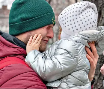  ?? ?? Poignant: Margo places her hand on her father’s cheek as he swallows his tears