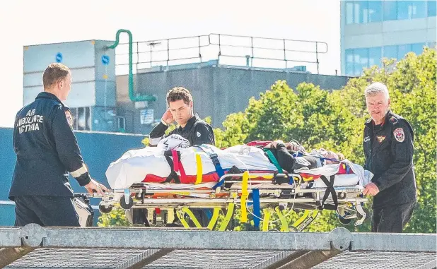  ?? Picture: EUGENE HYLAND ?? IN SAFE HANDS: TV presenter Grant Denyer is airlifted to the Alfred Hospital after a car crash yesterday.
