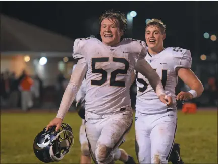  ?? AUSTIN HERTZOG - MEDIANEWS GROUP ?? Spring-Ford’s Blake Terrizzi (52) and Ian Harvie (54) race toward their sideline after defeating Perkiomen Valley during the 2019season.