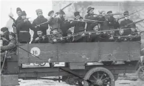  ??  ?? TAKING AIM: Members of the Red Guards at the Smolny Institute, which was chosen by Vladimir Lenin as Bolshevik headquarte­rs during the October Revolution in 1917.