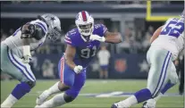  ?? MICHAEL AINSWORTH ?? File-This Nov. 28, 2019, file photo shows Dallas Cowboys’ Tyron Smith, left, and Buffalo Bills defensive tackle Ed Oliver (91) facing off during an NFL football game in Arlington, Texas. Oliver was arrested Saturday, May 16, 2020, by police in the Houston area and charged with drunk driving and illegally carrying a gun. Montgomery County sheriff’s deputies pulled Oliver over after receiving reports around 9p.m. of someone driving recklessly in a constructi­on area north of the city, local media outlets reported, citing jail and police records and statements from sheriff’s officials.