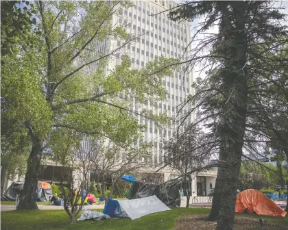  ?? KAYLE NEIS ?? Homeless people set up makeshift shelters outside city hall after an awareness event last week prompted a move from Pepsi Park.