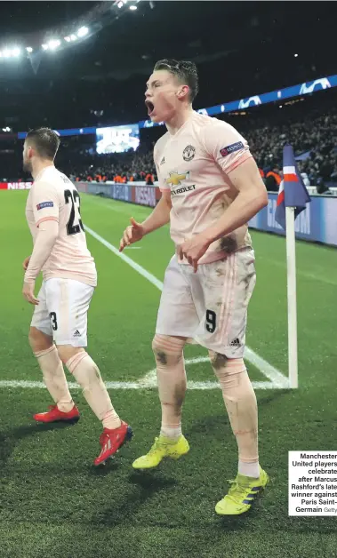  ?? Getty ?? Manchester United players celebrate after Marcus Rashford’s late winner against Paris SaintGerma­in