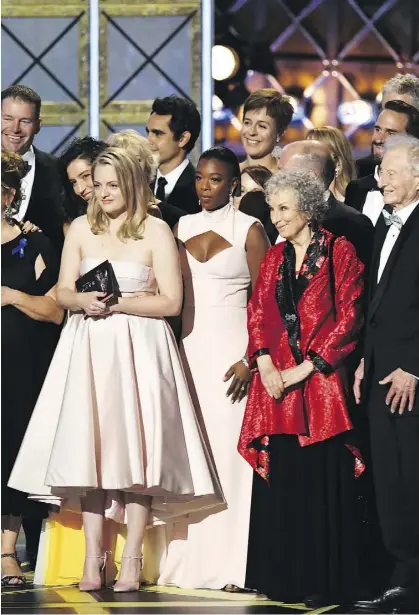  ?? GETTY IMAGES ?? The cast and crew of The Handmaid’s Tale and author Margaret Atwood, second from right, accept the Emmy for outstandin­g drama series.