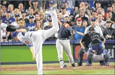  ?? AP PHOTO ?? Boston Red Sox’s Mitch Moreland hits a three-run home run off Los Angeles Dodgers relief pitcher Ryan Madson Saturday in Game 4 of the World Series.