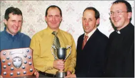  ?? ?? Incoming Avondhu Juvenile GAA Board chairman in 2002, Fr Alec Morrissey, with the Killavulle­n U12 management team who guided their charges to league and championsh­ip success in the 2002 season, l-r: Kevin Rice, Kevin Regan and John Magner, pictured at the juvenile social held in The Hazel Tree, Mallow.