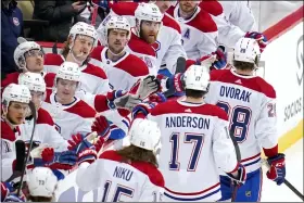  ?? GENE J. PUSKAR — THE ASSOCIATED PRESS ?? Montreal Canadiens’ Christian Dvorak (28) returns to the dugout after scoring during the third period of an NHL hockey game against the Pittsburgh Penguins in Pittsburgh, Saturday, Nov. 27, 2021.