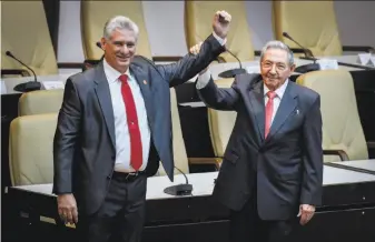  ?? Adalberto Roque / Associated Press ?? Cuba’s new leader, Miguel Diaz-Canel, (left) made clear in a speech that he would defer to Raul Castro (right) who, along with his brother Fidel, ruled the island nation for six decades.