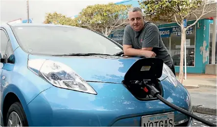  ?? PHOTO: CAMERON BURNELL/STUFF ?? Tawa resident Nathan Murrell has driven his Nissan Leaf around Wellington for 18 months, and says the car is perfect for the capital.